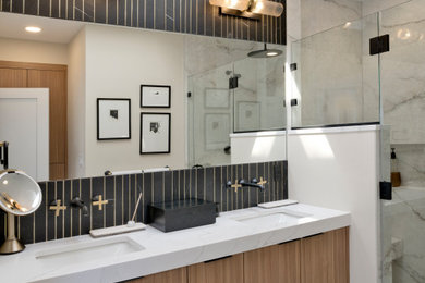 Large trendy master black tile and marble tile porcelain tile, white floor, double-sink and wallpaper bathroom photo in DC Metro with flat-panel cabinets, light wood cabinets, a one-piece toilet, beige walls, an undermount sink, quartz countertops, a hinged shower door, white countertops and a floating vanity