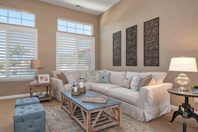 Inspiration for a mid-sized coastal formal and open concept light wood floor and brown floor living room remodel in San Diego with brown walls, no fireplace and no tv