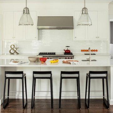 Low-back bar stools maintain a continuous flow between the kitchen and living ro