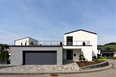 Photo of a large contemporary detached two-car garage in Bremen.