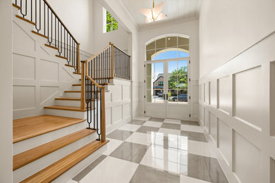 Inspiration for a transitional wooden l-shaped wood railing and wall paneling staircase remodel in Dallas with painted risers