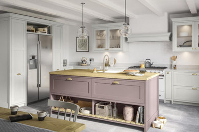 Inspiration for a medium sized classic u-shaped kitchen/diner in Other with a built-in sink, shaker cabinets, grey cabinets, wood worktops, yellow splashback, ceramic splashback, stainless steel appliances, an island and white worktops.