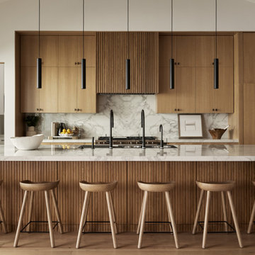 Luxury Kitchen Design with Custom Cabinetry and Dual Faucet Workstation by Brana