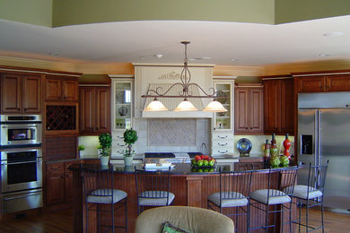Example of a transitional kitchen design in Atlanta with white appliances