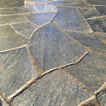 Chocolate Charcoal Quartzite Flagstone Patio with Basalt Column Fountain