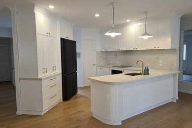 This is an example of a contemporary kitchen in Brisbane.