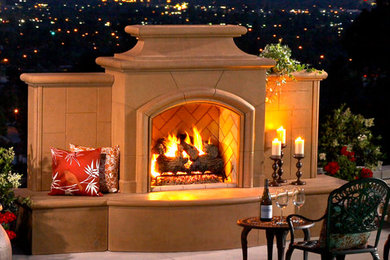 Mid-sized elegant backyard tile patio photo in Orange County with a fire pit and no cover