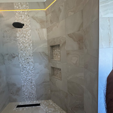 Curd-less walk-in shower; heated floors in bathroom + shower+bench LED