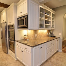 Kitchen with tile floors/wood house