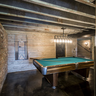 Photo of a country walk-out basement in Louisville with brick flooring.