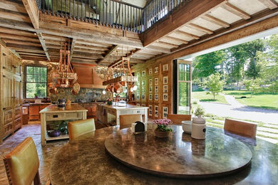 Inspiration for a rustic u-shaped beige floor eat-in kitchen remodel in New York with shaker cabinets, medium tone wood cabinets, wood countertops, two islands and brown countertops