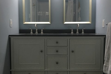 Mid-sized minimalist 3/4 porcelain tile and gray floor bathroom photo in Richmond with raised-panel cabinets, white cabinets, blue walls, an undermount sink and quartz countertops