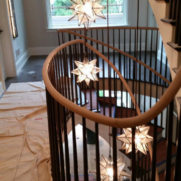 Stacked Circular White Oak Staircase with Wooden Balusters Project