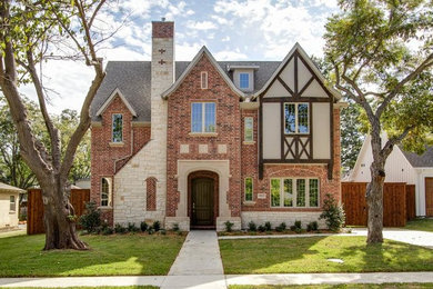 Inspiration for a large transitional red two-story mixed siding exterior home remodel in Dallas