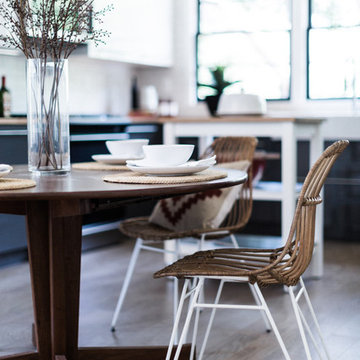 Rattan Paperclip Leg Dining Chairs with Vintage Dining Table in Open Plan Kitche