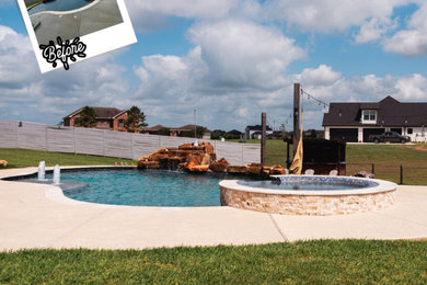 Large elegant backyard stone pool photo in Houston