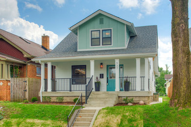 Inspiration for a mid-sized craftsman white two-story wood exterior home remodel in Indianapolis with a shingle roof