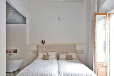 Photo of a large mediterranean guest bedroom in Barcelona.