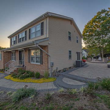 Dual patio with adjoining firepit feature