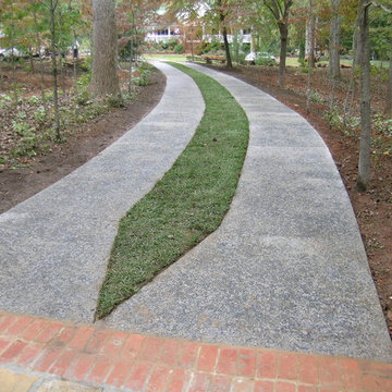 Exposed Aggregate concrete strips, stained gray and washed