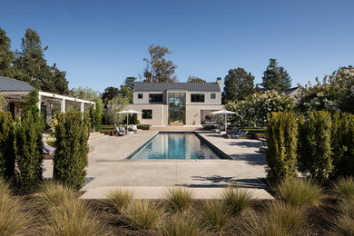 Photo of a country backyard rectangular pool in San Francisco with a pool house.