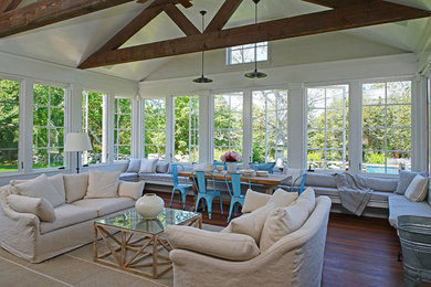 Inspiration for a huge farmhouse dark wood floor and brown floor sunroom remodel in Boston with a standard ceiling