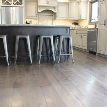 Farmhouse kitchen Taupe Painted Cabinets,Quartz Tops, and Dark Island