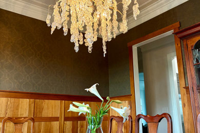 Dining room - transitional wainscoting dining room idea in Raleigh