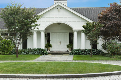 Large modern white two-story wood exterior home idea in New York