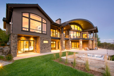 Example of a large transitional beige two-story mixed siding exterior home design in Salt Lake City