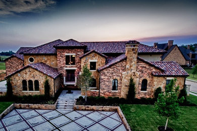 Tuscan exterior home photo in Dallas