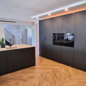 Black matt modern luxury plywood kitchen with island.