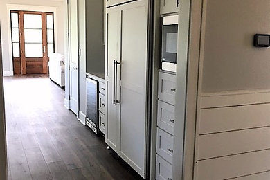 Example of a farmhouse hallway design in Little Rock