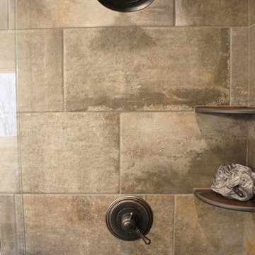 Moline, IL Bath Remodel With Gray Stained Cherry Vanity and Pebble Tiled Shower