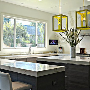 Large transitional kitchen pantry ideas - Kitchen pantry - large transitional u-shaped dark wood floor and brown floor kitchen pantry idea in Jackson with an undermount sink, flat-panel cabinets, medium tone wood cabinets, paneled appliances, an island, marble countertops, beige backsplash and marble backsplash