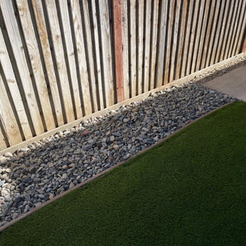 Artificial Grass with Paver Walkway and River Rock