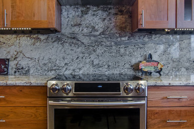 Inspiration for a large craftsman u-shaped beige floor eat-in kitchen remodel in Seattle with an undermount sink, shaker cabinets, light wood cabinets, granite countertops, stone slab backsplash, stainless steel appliances and no island