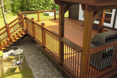 Example of an arts and crafts deck design in Ottawa