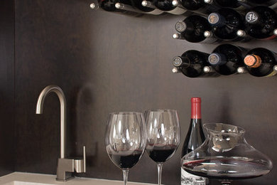 Inspiration for a contemporary wine cellar remodel in Other