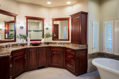 This is an example of a large traditional master bathroom in Atlanta with raised-panel cabinets, dark wood cabinets, a freestanding tub, a curbless shower, a two-piece toilet, beige tile, porcelain tile, beige walls, porcelain floors, an undermount sink, engineered quartz benchtops, beige floor and a hinged shower door.