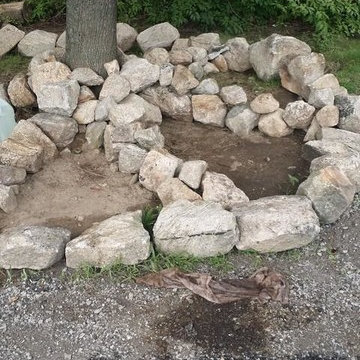 Rock relocation - before flower beds installed