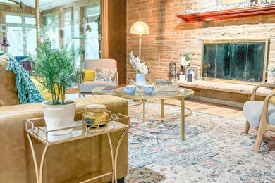 Mid-sized elegant formal and open concept light wood floor, beige floor and wallpaper living room photo in Chicago with brown walls, a standard fireplace, a stacked stone fireplace and no tv