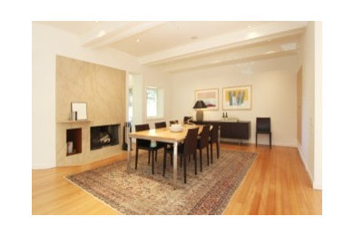 Example of a light wood floor enclosed dining room design in San Francisco