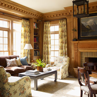 Large modern study in Bridgeport with brown walls, dark hardwood flooring, a standard fireplace and a tiled fireplace surround.