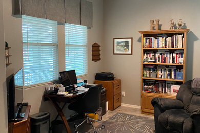 Example of a transitional home office design in Phoenix