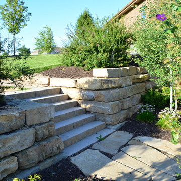 Comfortable backyard retreat with fire pit, paver patio and pool design