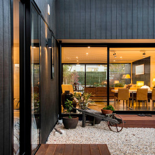 Inspiration for a small contemporary courtyard patio in Christchurch with gravel and no cover.