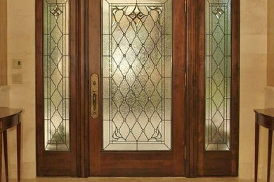 Single front door - victorian ceramic tile single front door idea in Denver with beige walls and a dark wood front door