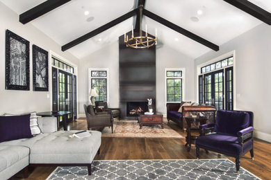 Large transitional open concept medium tone wood floor and brown floor living room photo in Denver with gray walls, a standard fireplace, a metal fireplace and no tv