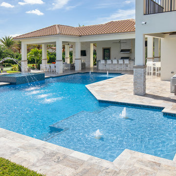 Custom Shaped Pool With Spa, Laminar Deck Jets and Custom Fountain in Parkland